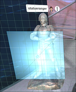 A first-person perspective of a user grabbing the gizmo surrounding a 3D model and moving it to a new position.