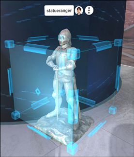 A blue gizmo with controls for moving, rotating, and scaling the 3D model it surrounds.