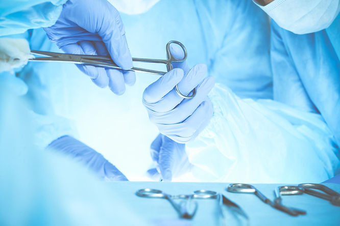 surgeons wearing medical gloves holding a pair of scissors