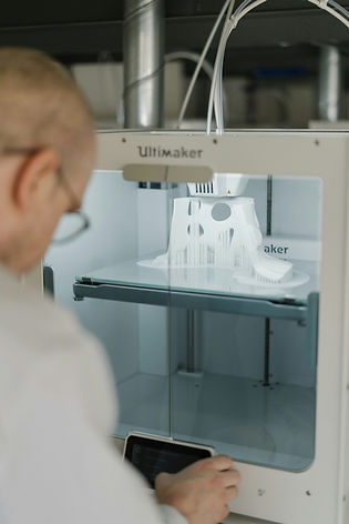 A doctor using a 3D printing machine