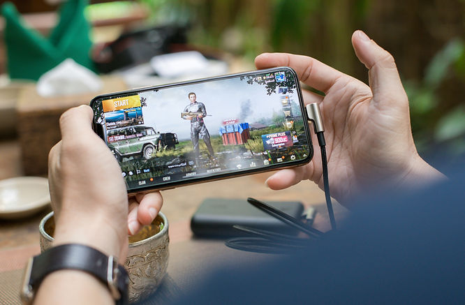 a man playing a survival mobile game